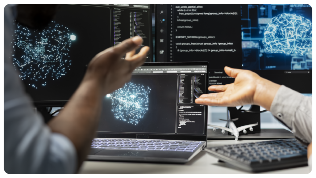 Hands gesturing in front of laptop with tech illustration.