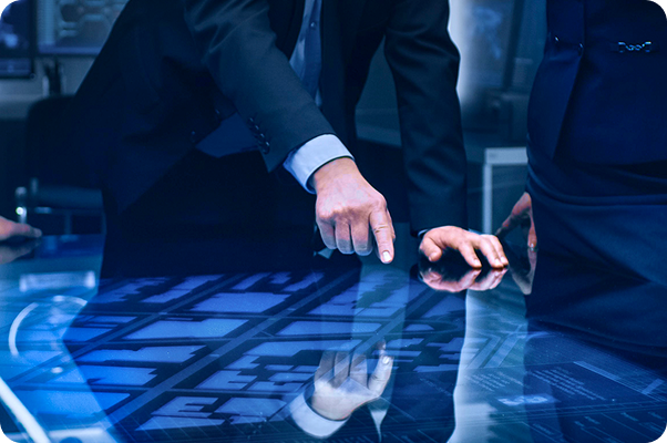 executive pointing to touch screen digital board showcasing multi-level strategy