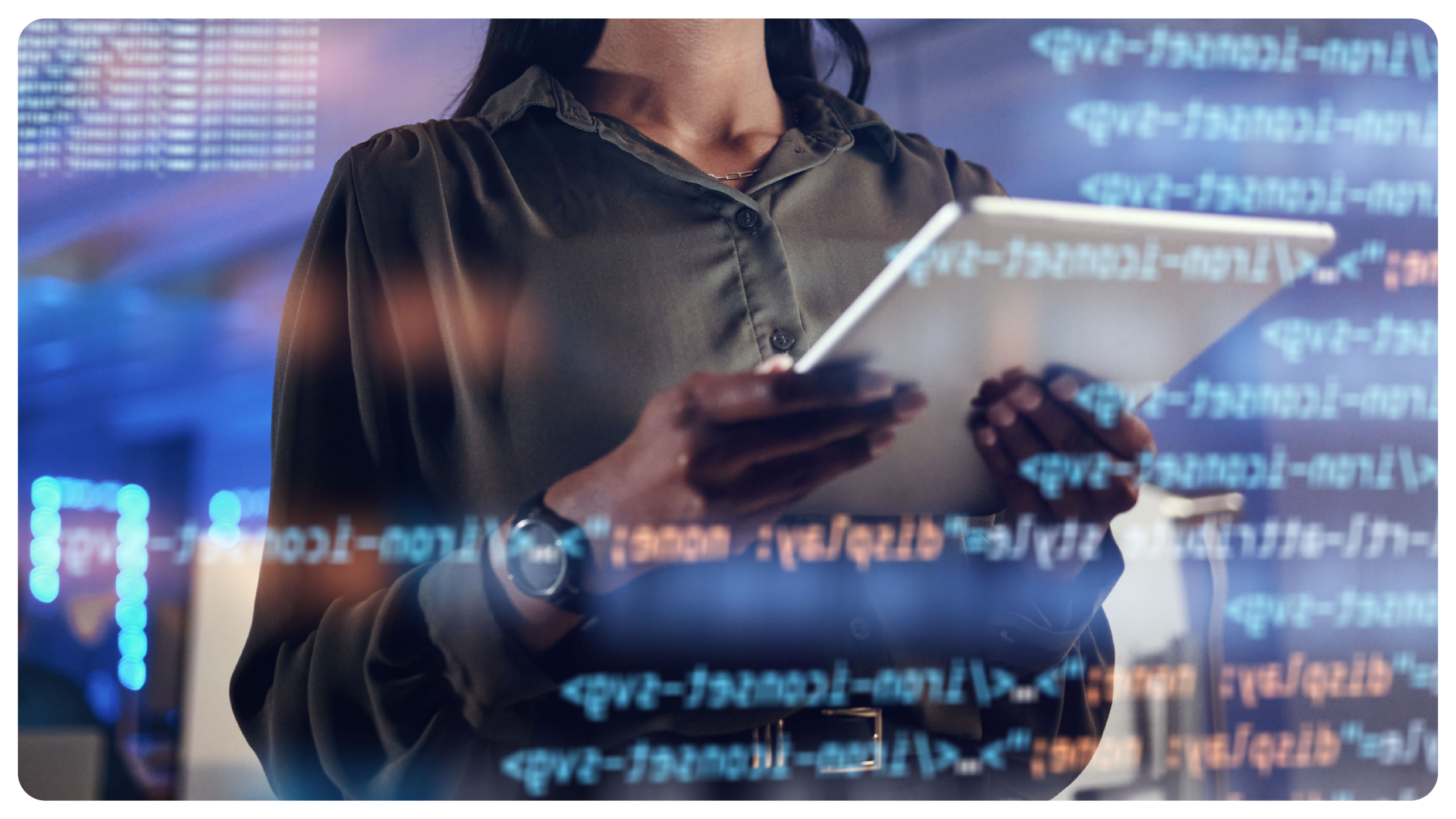 Enterprise professional reviewing software interface on tablet with code overlay